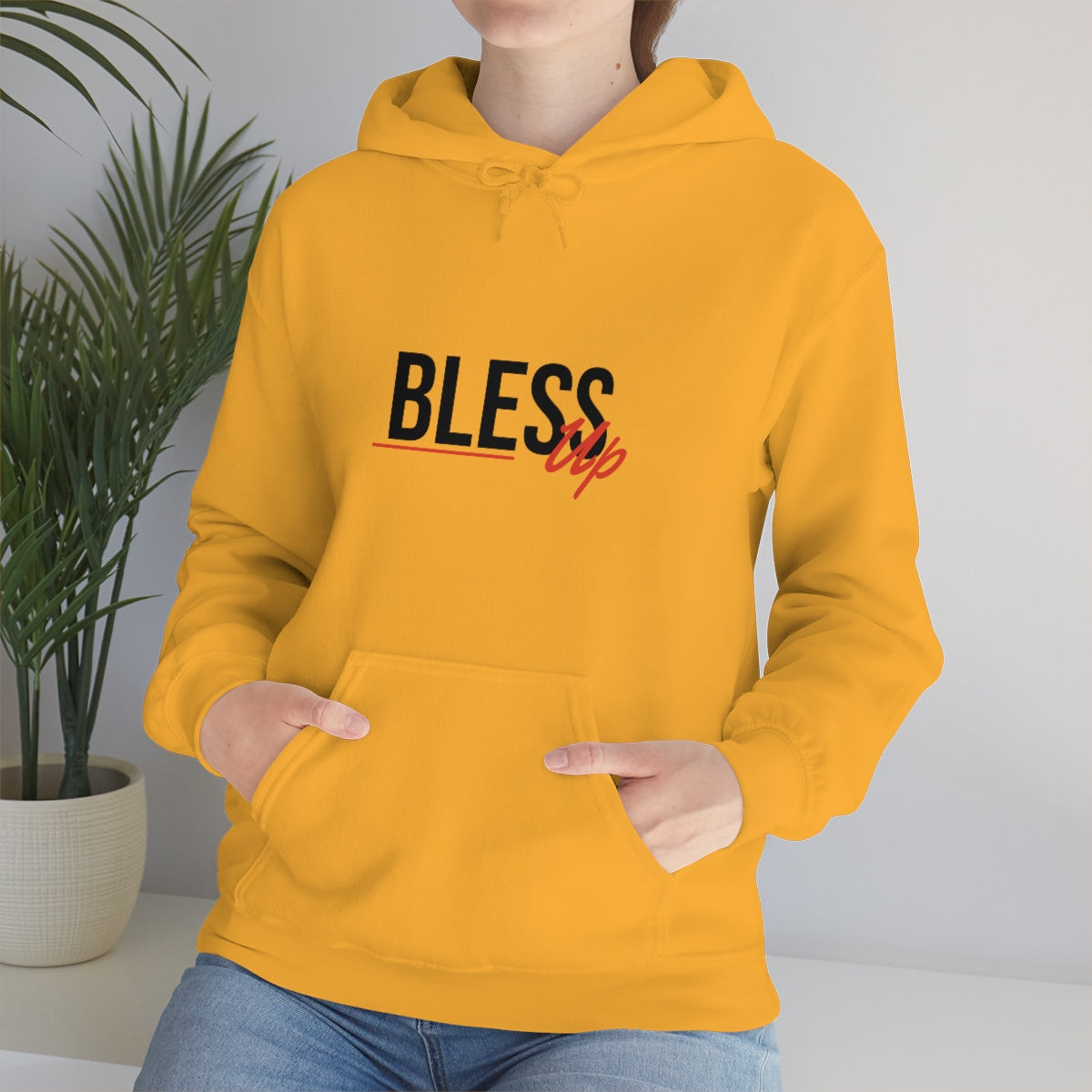 Yellow hoodie sweatshirt with bless up text in black and red